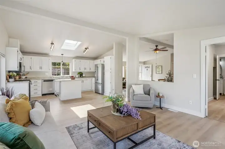 From the back of the house, you can see the kitchen and appreciate the multiple spaces this home offers.