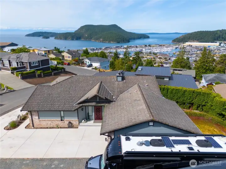 Overlooking spectacular Burrows Island and Burrows Bay as well as the Olympics. You can load your RV or boat right from your own driveway and be off on adventures in just minutes! This motorhome is 45' long including the motorcycle lift. There is plenty of room in front for a boat!