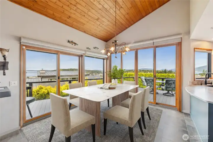 Entertain dinner guests in this generous dining space with walls of windows and leads to the deck for indoor/outdoor use.
