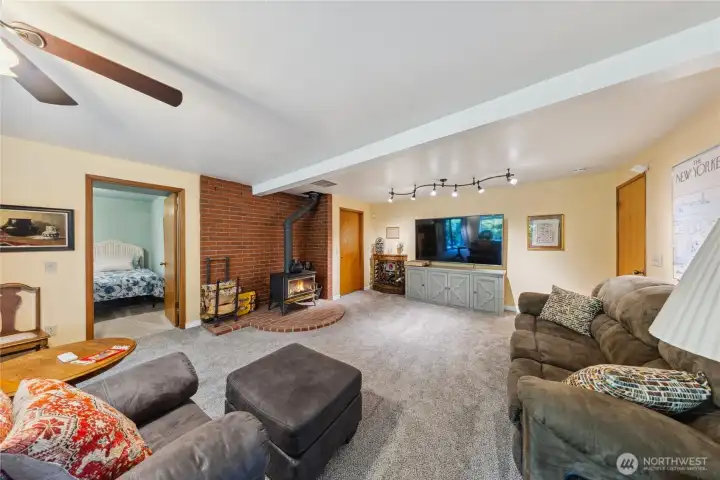 Downstairs offers a spacious family room, 2 bedrooms and a bathroom plus a mud room.