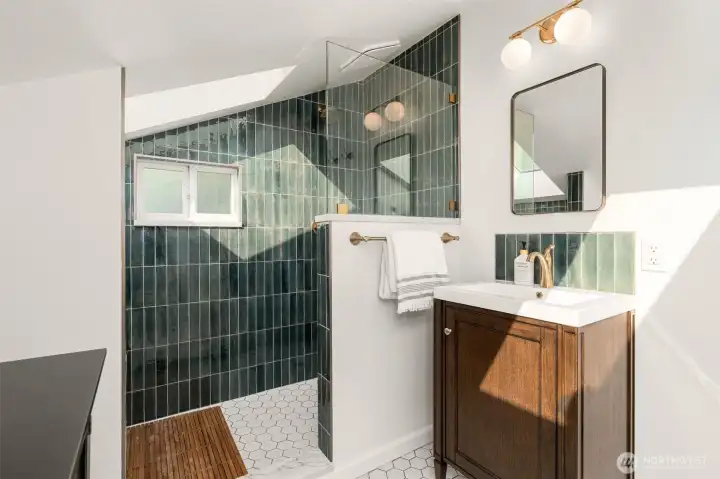 Remodeled bathroom on upper level with skylights and heated floors!