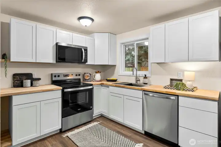 Brand new cabinetry and butcher block counter tops.