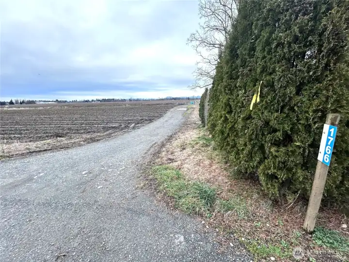Graveled entry to the property