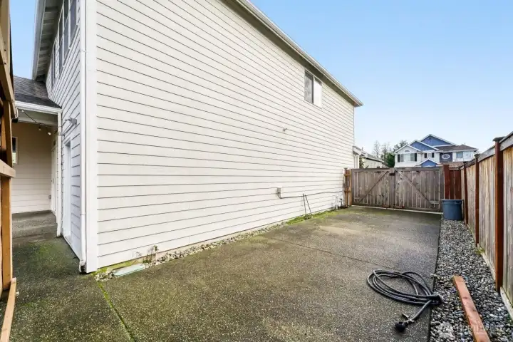 RV parking with 30 Amp Service, behind gate in backyard