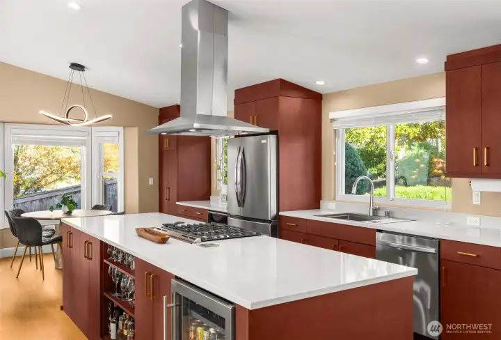 Fully remodeled designer kitchen. Quartz countertops, stainless steel appliances, beverage fridge, complete with a coffee bar.