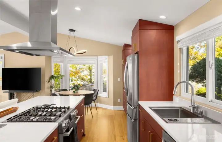 Gas stove, vaulted ceilings and custom cabinetry.