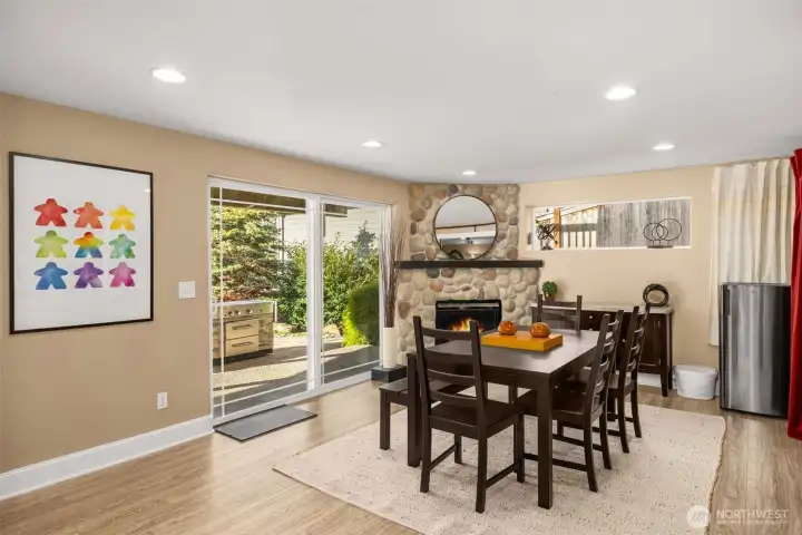 Lower level daylight basement living room with a gas fireplace.