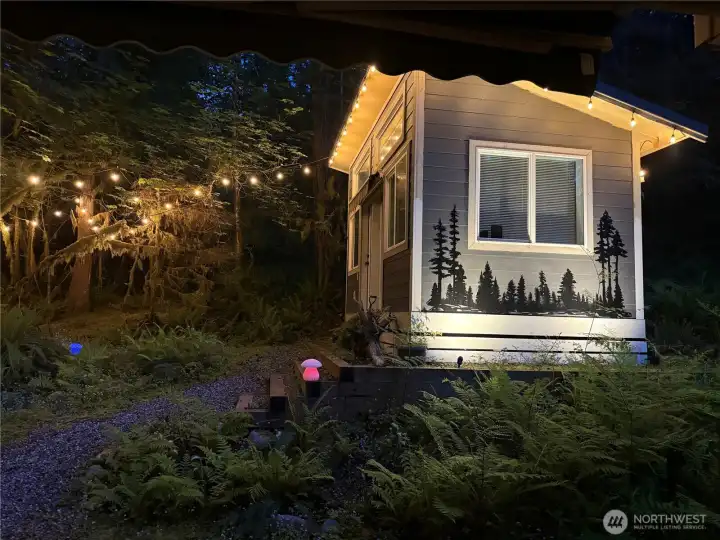 You could be enjoying this evening view of the enclosed gazebo at the back of the enchanting lot.