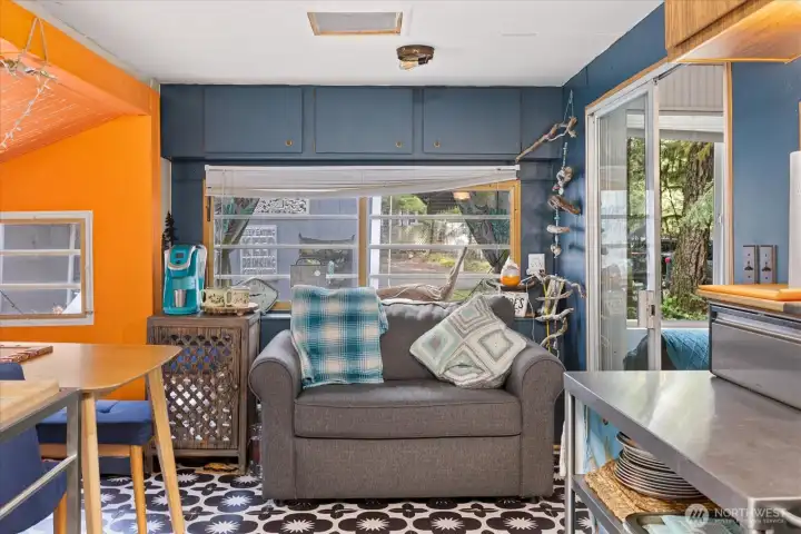 Cozy spot to sit and read or enjoy conversation when cooking is happening.