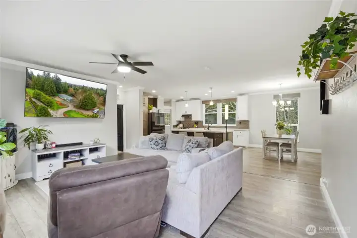 Welcoming entry opens into a bright, airy living space with soaring vaulted ceilings.