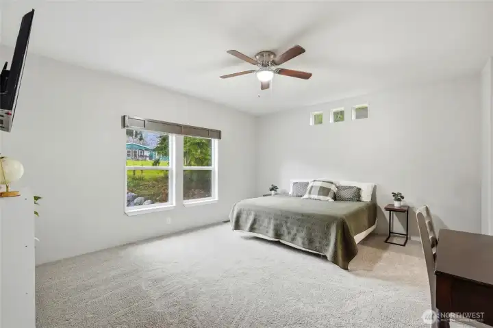 Spacious primary suite thoughtfully located for privacy and comfort.    Peaceful retreat designed for rest and relaxation at the end of the day.