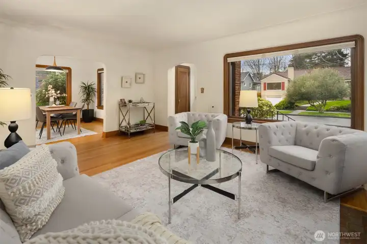 Seamless flow between living room, dining & kitchen.