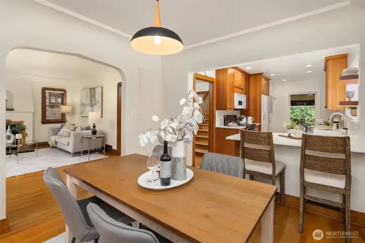 Dining room with seamless flow into kitchen & living room.
