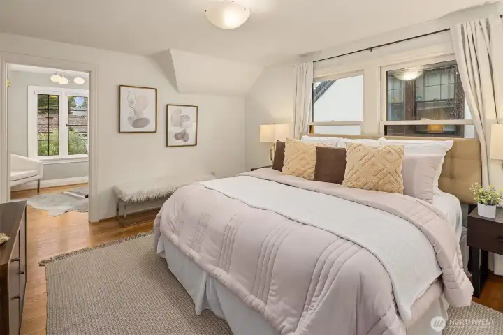 Upstairs primary bedroom with adjoining room ideal for a home office, nursery, or generous walk-in closet.