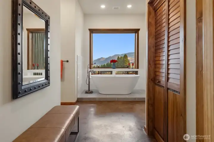 His dressing area adjacent to large walk-in closet