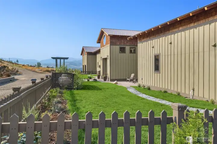 Perfect fenced area for dogs, don't miss the "garden room" off the entry patio area