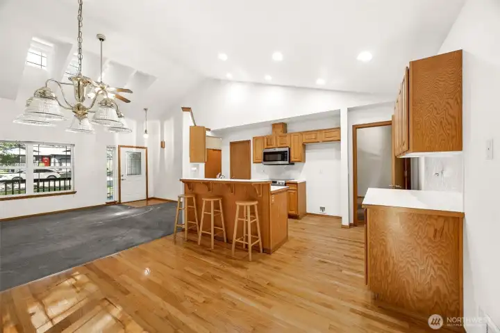 Living room, dining room and kitchen with cathedral ceilings. Walk-in pantry, too!