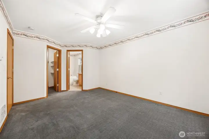 Primary bedroom on the Main floor with walk-in closet and ensuite with jetted tub.