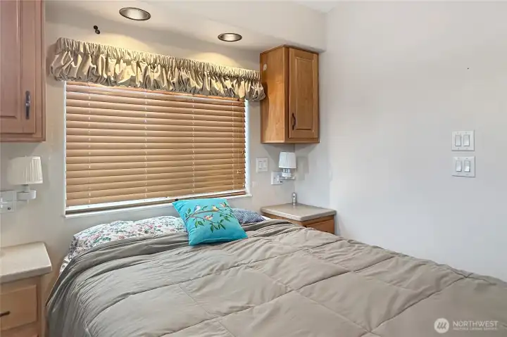 Cozy bedroom retreat with soft natural light, perfect for unwinding after a day by the water.