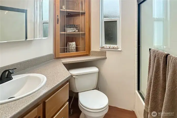 Fresh, light-filled bathroom with smart storage and an easy, low-maintenance design