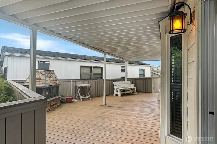 Spacious covered deck, perfect for relaxing or entertaining in any season.