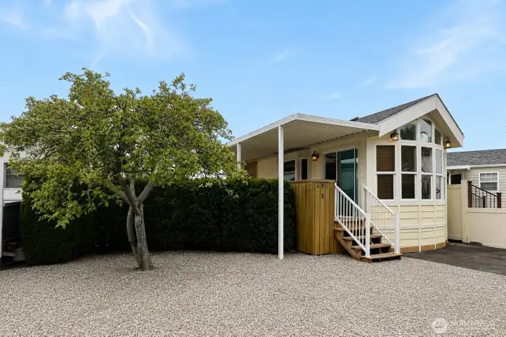 Charming mature landscaping creates a private retreat inside the fenced yard. Charming mature landscaping creates a private retreat inside the fenced yard.