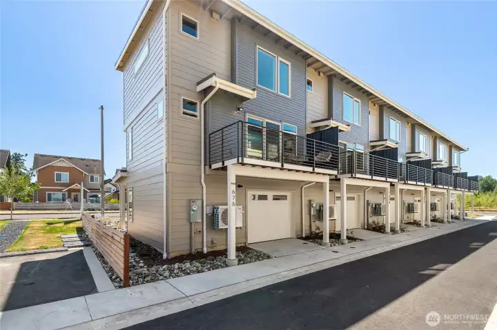 This is an end unit and a view of the private garage & deck
