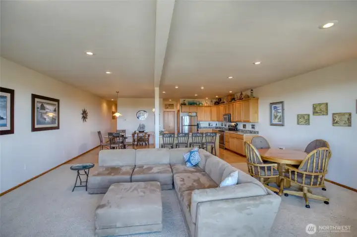 Second floor of the condo features open concept living/dining/kitchen space.