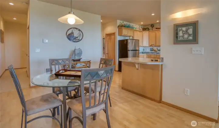With space for a dining table, and seating space at both kitchen peninsulas, there is plenty of room for meals with friends.  Pantry and powder room are just off the kitchen.