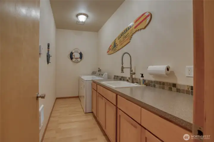 The utility room is huge and has plenty of space for folding laundry or other chores.