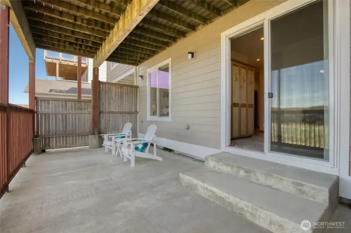 Stepping outside, the patio is fenced, spacious, and private.