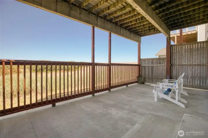 Enjoy beautiful dune views and gentle breezes from this area that expands your living space into the outdoors.