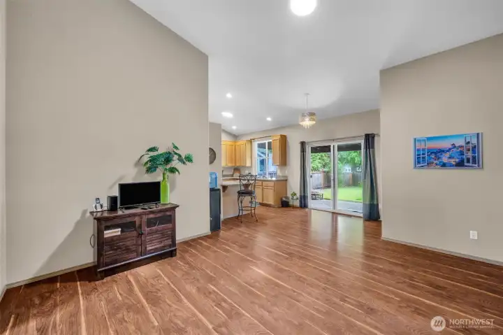 Expansive family room offers an open layout that flows seamlessly into the kitchen, creating the perfect space for gatherings, movie nights, and everyday living.