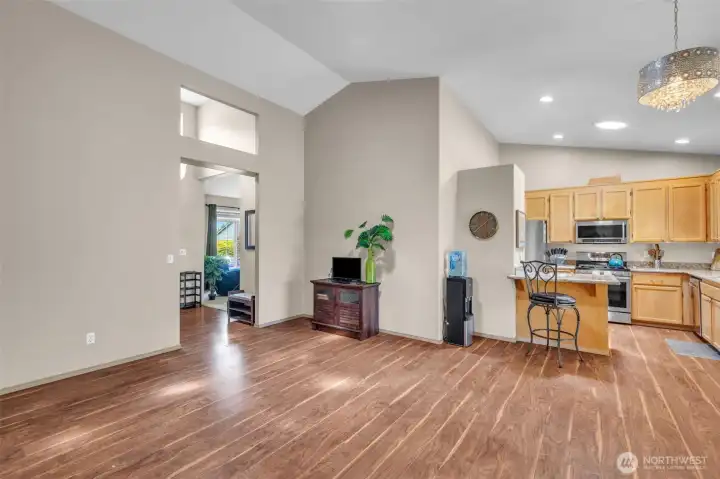 The heart of the home! Spacious family room flows into the well-appointed kitchen with granite countertops, maple cabinetry, stainless steel appliances, and breakfast bar seating, creating an inviting space for everyday living and entertaining.