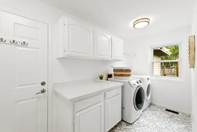 Laundry with new quartz countertops and flooring