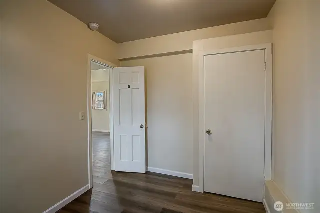 Lower unit bedroom 1 features new vinyl flooring installed in 2019