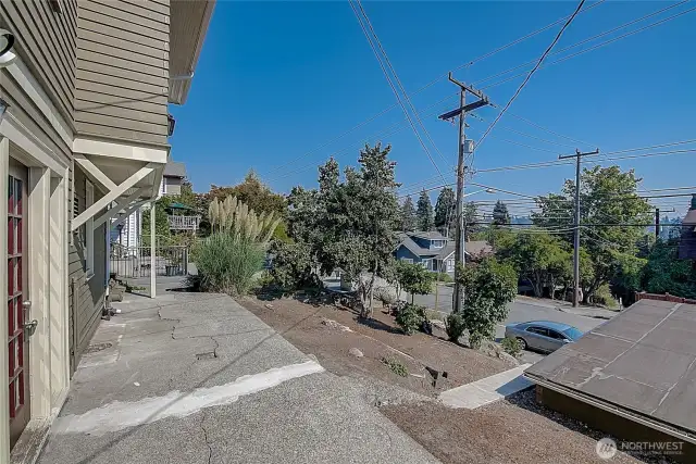 Lower unit patio with access to the detached garage