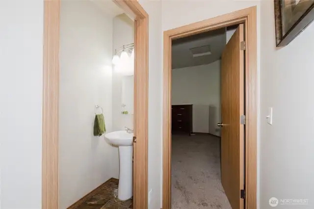 The half bath and hall goes to the primary suite.