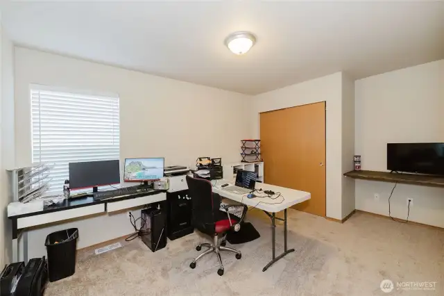the 4th spacious bedroom on the bottom floor, also makes a great office.