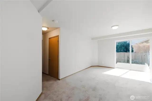 The lower-level family room opens to a nice deck. door on the left goes to the bathroom.