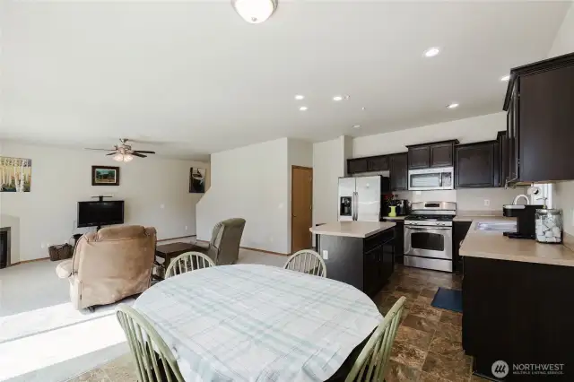 Dining, kitchen and living room, the door next to the fridge hosts a spacious walk-in pantry, it has it all!!