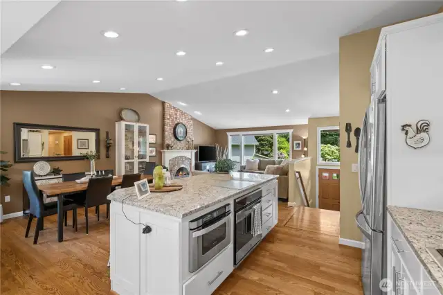 Built-in stainless steel appliances are seamlessly integrated into the island’s interior, providing a clean kitchen aesthetic alongside a highly functional cooking space.