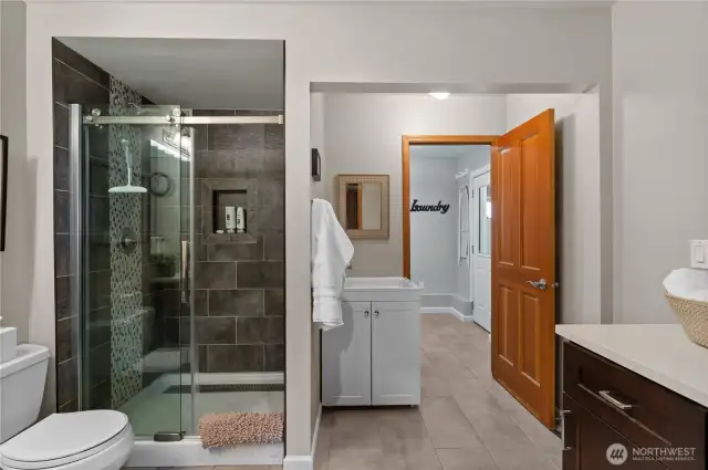 The laundry room adjoins the bathroom and also provides access to the hot tub.