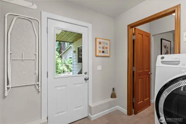 Steps from the laundry and bathroom is a covered patio where you can enjoy the hot tub year round.