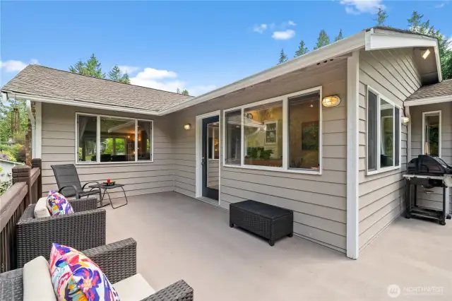 Dry deck coating on this oversized deck is low maintenance and provides a dry patio beneath for the hot tub.