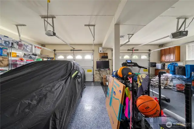Large garage with surround sound system and speakers that convey. Custom flooring.