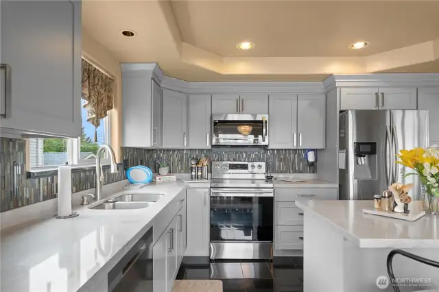 Luxurious quartz counters and modern cabinets