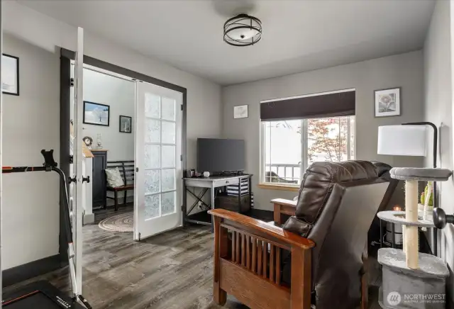 The great thing? French doors and a door on the opposing side of the room, create a quiet place to dine, work, or relax.