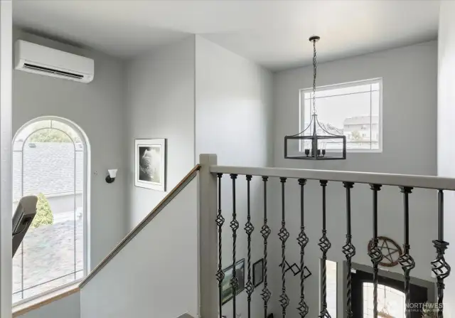 New railing, trim and a ductless mini-split! Loads of natural light fill the space.