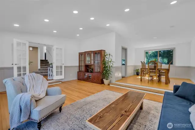Large living room with beautiful hardwood floors and...
